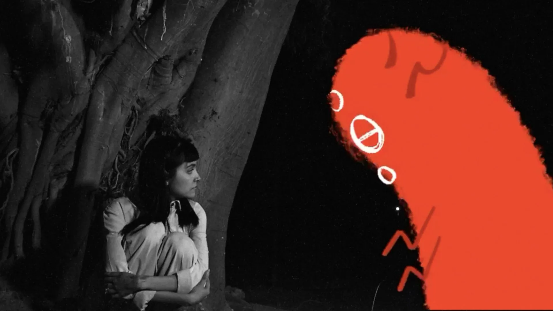 Protagonista de Claroscuro con su pintura de creatura roja.