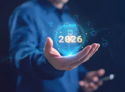 Un hombre de negocios sosteniendo un globo de IA holográfica brillante con 2026 e inteligencia artificial, computación en la nube, red neuronal e iconos de ciberseguridad, que representan la tecnología futura. Tendencias de la IA en 2026.
