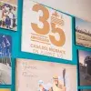 Resepcion de la casa del migrante con fotografias y reconocimientos 